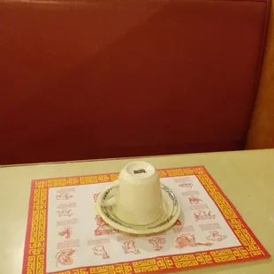 a table with a cup and saucer on it