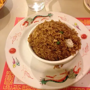 a bowl of rice and a plate of fries