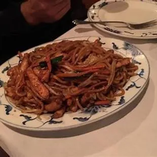 a plate of noodles and shrimp