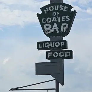 a sign for a liquor bar