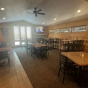 a dining room with tables and chairs