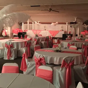 tables covered with pink and white linens