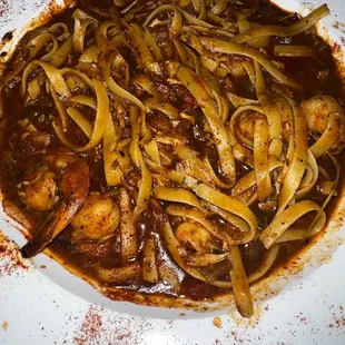 a plate of pasta and meat
