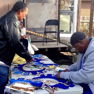 Ronald Lewis (right, seated) and Pete Alexander working on suits for the Big Nine second line.
