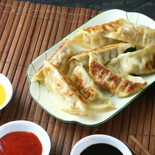 Mini Chicken pot sticker with dipping sauce.