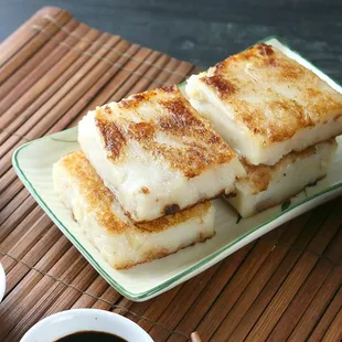 Pan fried turnip cake, dipping with the chili oil. Yummy