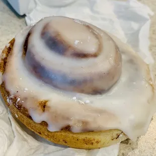 a cinnamon roll with icing