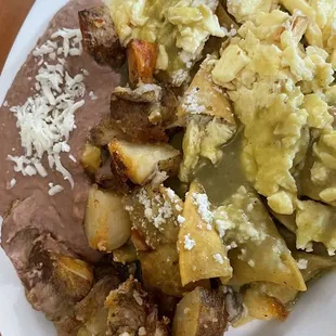 Green chilaquiles, homemade potatoes and beans.