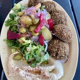 Five large falafel were crispy on the outside and so flavorful.  Tasty salad and good sized portion of hummus.