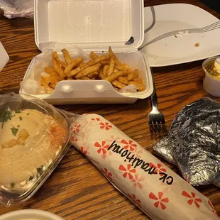 Fries, hommus, a small OMG sauce, and a traditional chicken shawarma