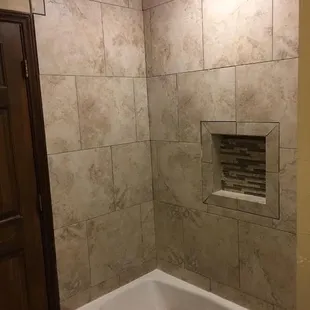 Shower nicho and tub surround.