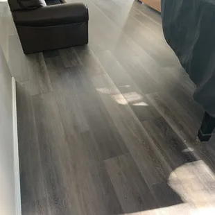 Beautiful 20mm Pergo luxury vinyl that is strong enough to hold the weight of our grand piano with no denting.