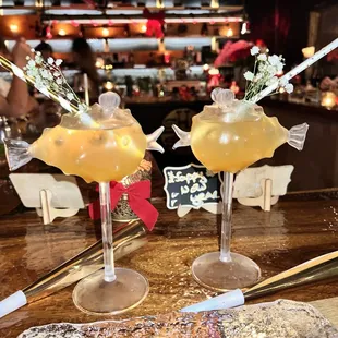 two cocktails on a bar