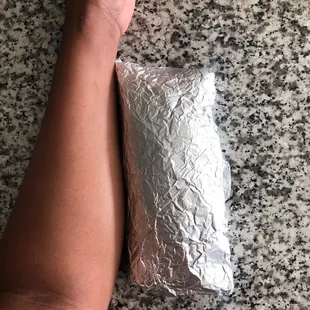 My forearm next to the breakfast burrito lmao almost the same size!