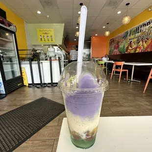 a purple drink in a plastic cup