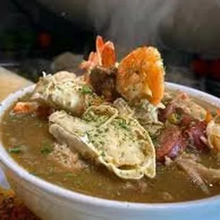 a bowl of gumbo with shrimp and shrimp