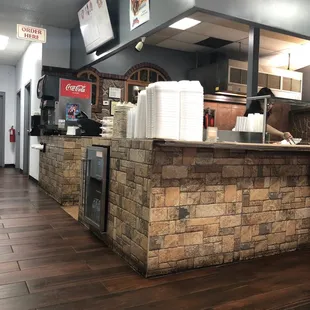 a kitchen with a brick counter