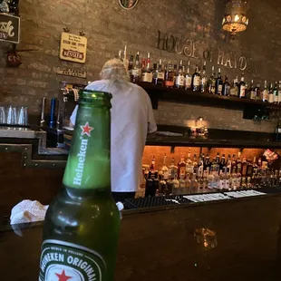 a bottle of heineken on a table