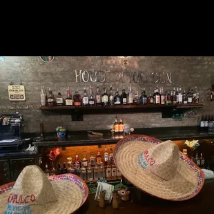 two hats on a bar