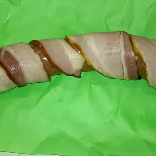 The bacon wrapped Hungarian brat, they don&apos;t sell it so I made it.