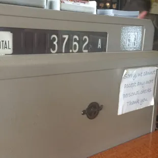 Old fashioned cash register, still in use!