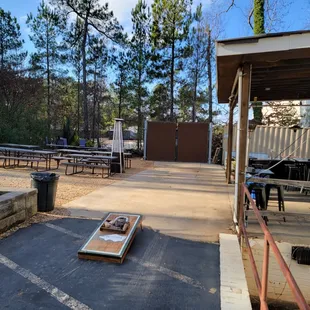 Enjoy some cornhole while hanging out in our outside area