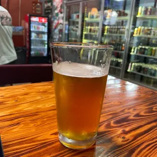 a glass of beer on a table