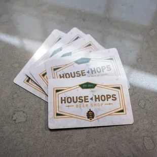 a stack of house of hops coasters