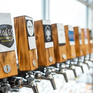 a row of beer taps