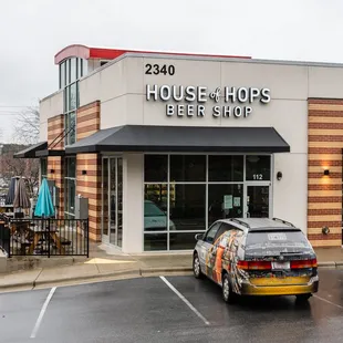 a car parked in front of a store