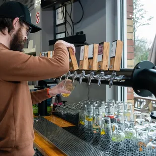 a man pouring a drink