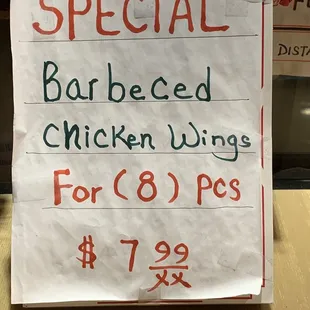 a sign for special barbecued chicken wings