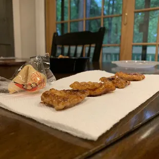 Fortune cookie is to give relativity to how thin that chicken was.