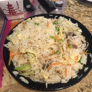 Vegetable fried rice was basically oily white rice tossed with undercooked or still frozen in the middle veggies.
