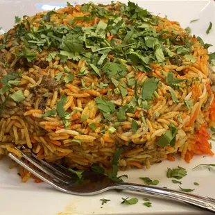 a plate of rice and vegetables