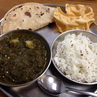 Aloo palak with rice and chapati.