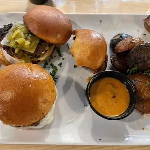 Slider Trio with roasted potatoes.