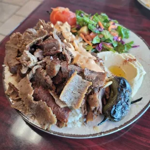Triple meat plate with gyro, beef shwarma and chicken shwarma with side salad and rice $ 20.99
