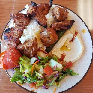 Beef kabob, rice, salad, hummus