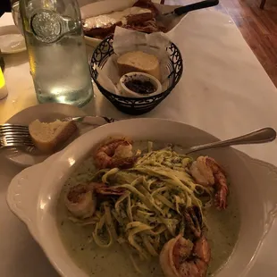 a bowl of pasta and shrimp