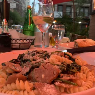 a plate of pasta with meat and vegetables