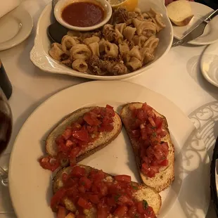 a plate of pasta and a sandwich