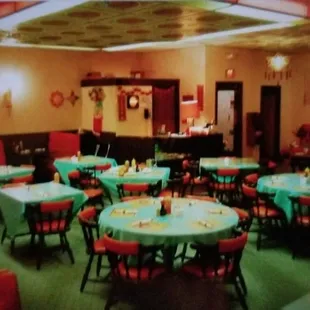 a dining room with tables and chairs