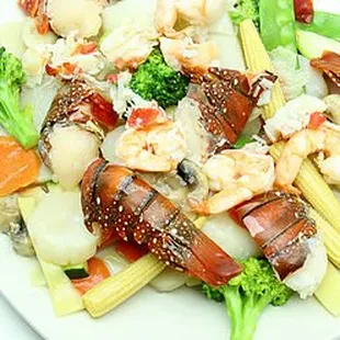 a plate of lobster and broccoli