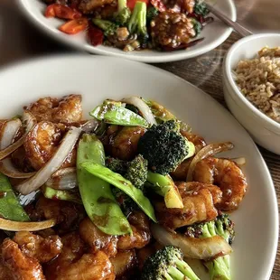 Foreground: Sa Sa-Cha Shrimp. Background: General Tso&apos;s Shrimp. Both with fried rice $3 up charge