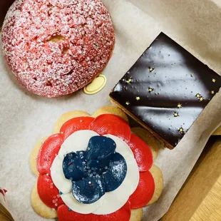 Strawberry cream puff; Millionaire bar; shortbread cookie with French colors icing