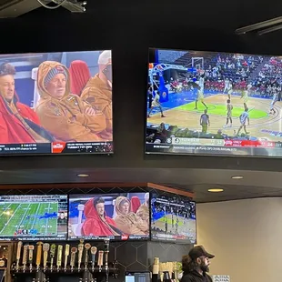 a bar with several televisions