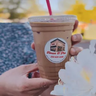 a person holding a cup of coffee