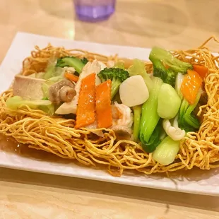 a plate of noodles and vegetables