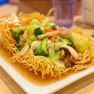 a plate of noodles and vegetables